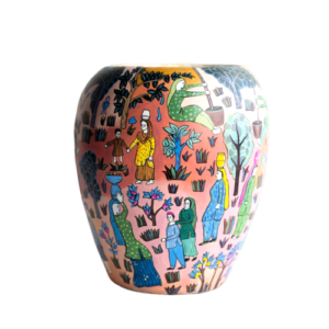 The Village Chronicle Hand-Painted Narrative Vase Bring the charm of timeless storytelling into your home. This exquisite ceramic vessel is more than just a vase; it is a canvas showcasing a vibrant tapestry of rural life. Hand-painted by skilled artisans, the intricate illustrations depict a harmonious community gathering—women in traditional attire carrying harvests, children at play, and lush, stylized flora that evokes a sense of peace and heritage. Every brushstroke tells a story, blending rich earthy tones with pops of azure and emerald to create a piece that feels both ancient and modern. Whether styled with a simple dried floral arrangement or left as a standalone statement piece, this vase adds a soulful, bohemian touch to any interior. Key Features Artisanal Craftsmanship: Each piece is individually hand-painted, ensuring that your vase is a one-of-a-kind work of art. Narrative Design: Features a 360-degree folk-art scene inspired by traditional pastoral life. Versatile Decor: The warm, multi-colored palette complements both minimalist modern spaces and eclectic, maximalist homes. Premium Finish: High-quality ceramic with a smooth matte-satin finish for a sophisticated look and feel. Product Specifications Material: 100% Hand-fired Ceramic Style: Folk-Art / Ethno-Contemporary Care: Wipe with a soft, dry cloth; avoid abrasive cleaners to preserve the hand-painted details.